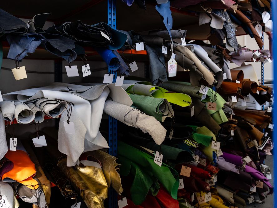 Rows of different fabrics, rolled up for storage