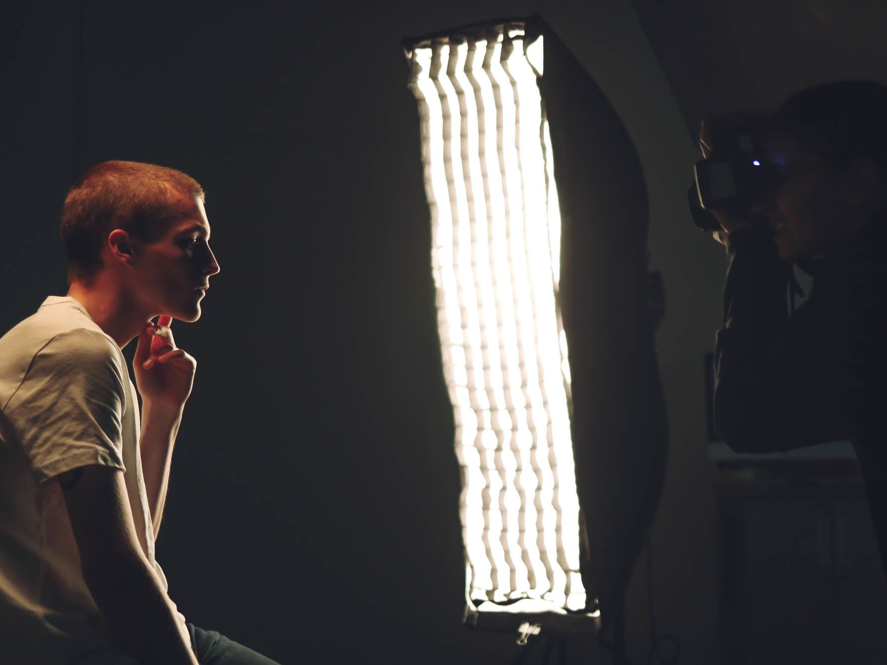 Student posing while being photographed