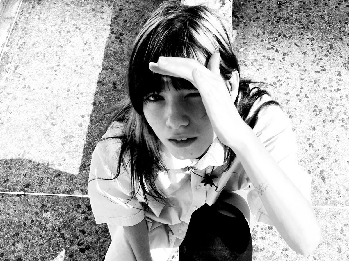 Greyscale photograph of a person looking up.