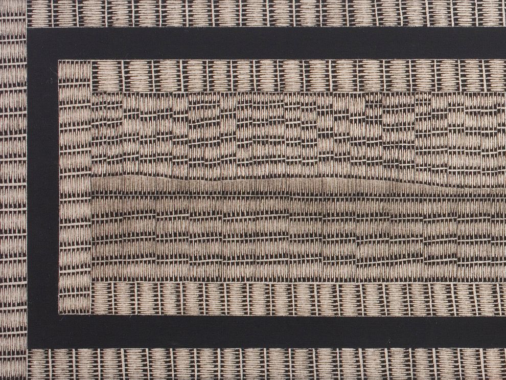 A solid border frames an intricate black and white pattern of lines. 