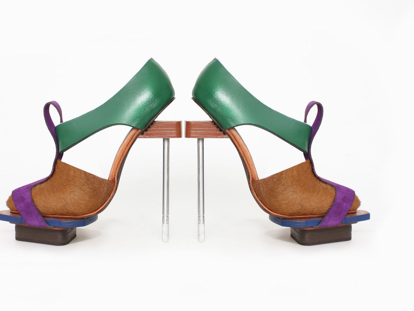 A pair of green, blue and brown shoes produced by a student at London College of Fashion
