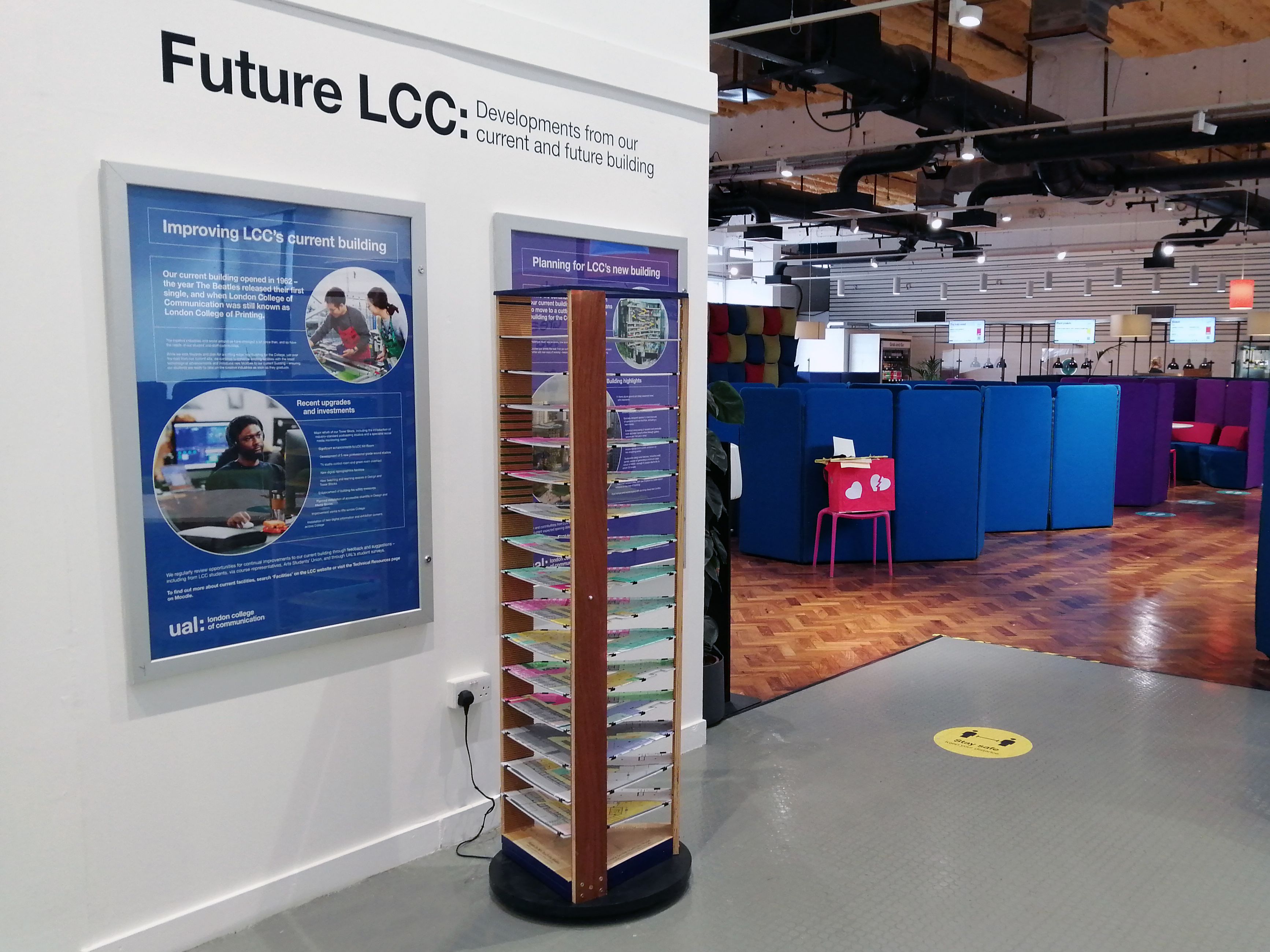 The 3D model of LCC's new building and two A0 posters, installed in the foyer area of the canteen