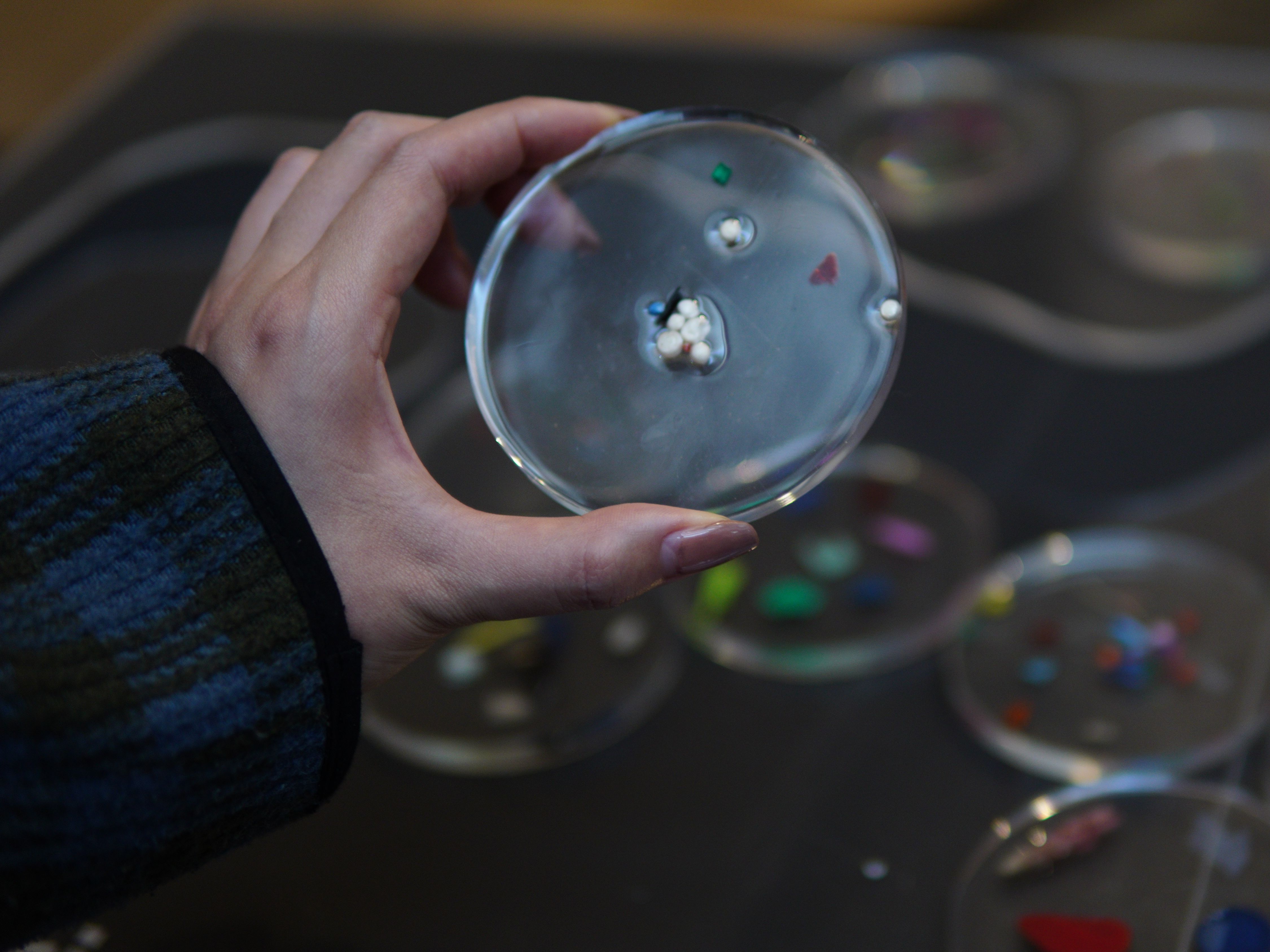 Hand holding microplastic sample