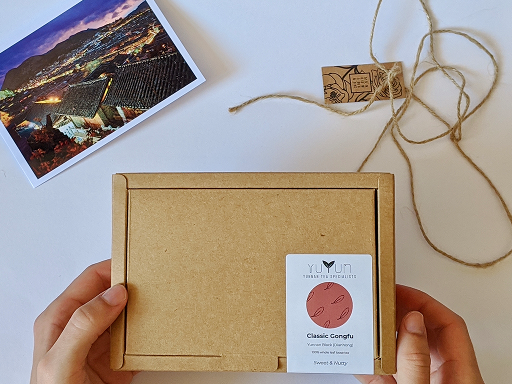 Photo of Yuyun's packaging with a postcard