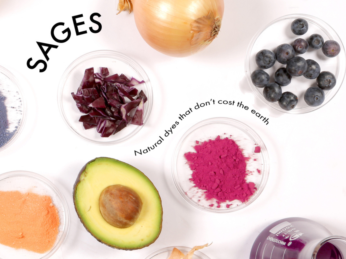 An assortment of natural dyes, including powders and fruits like avocado and blueberries, arranged around the text 
