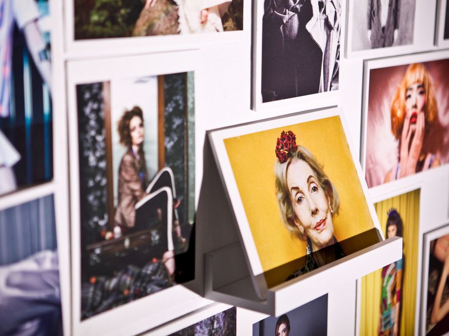 A collection of polaroid photographs on wall  taken by students at London College of Fashion