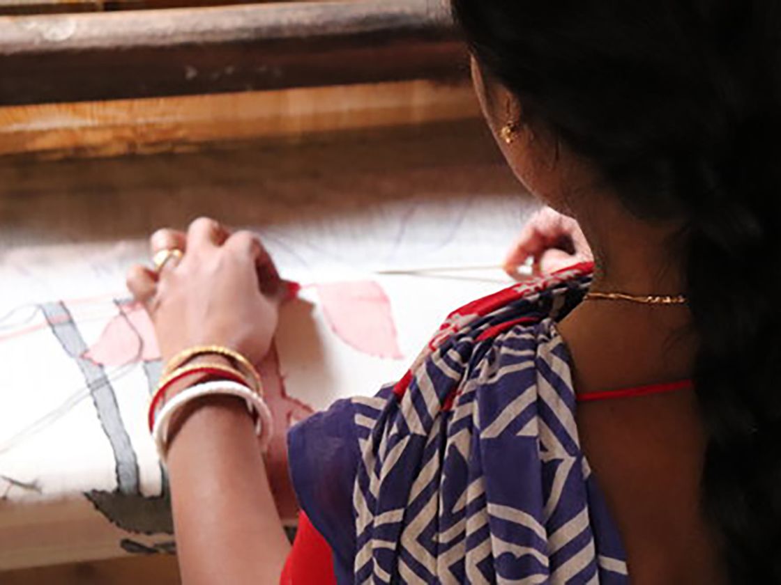 Women working with different textiles and different traditional methods