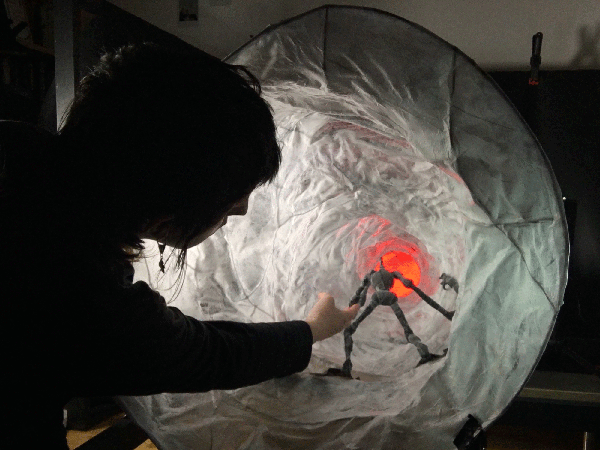 Silhouette of Emine, creating moving the models used in her film