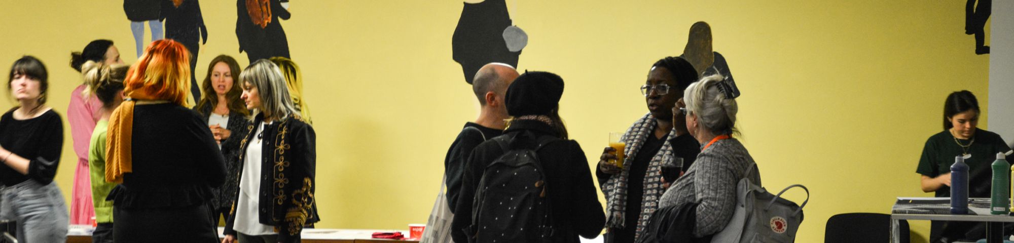 group of people talking at an event