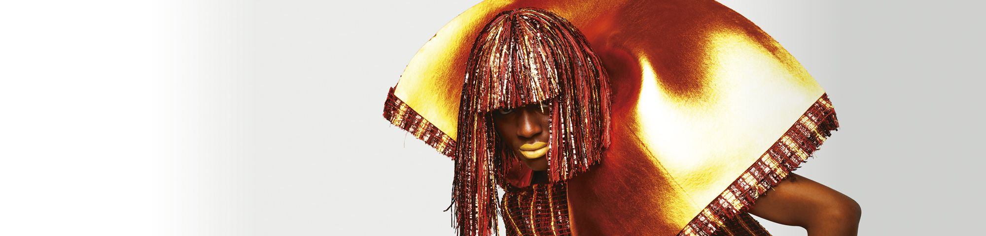 Model wearing red and gold