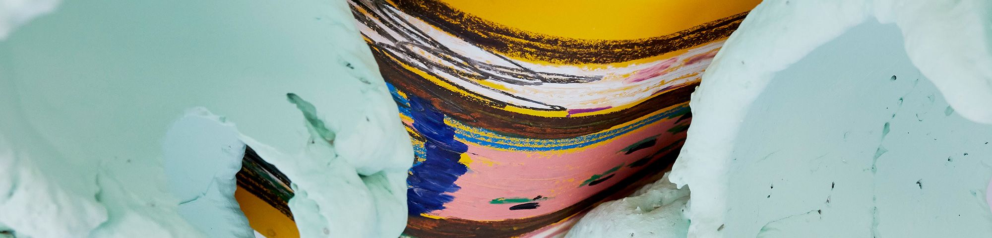Light green foam sculpture and yellow, pink, brown and blue abstract drawing by Yasmin Goodison-Braithwaite.