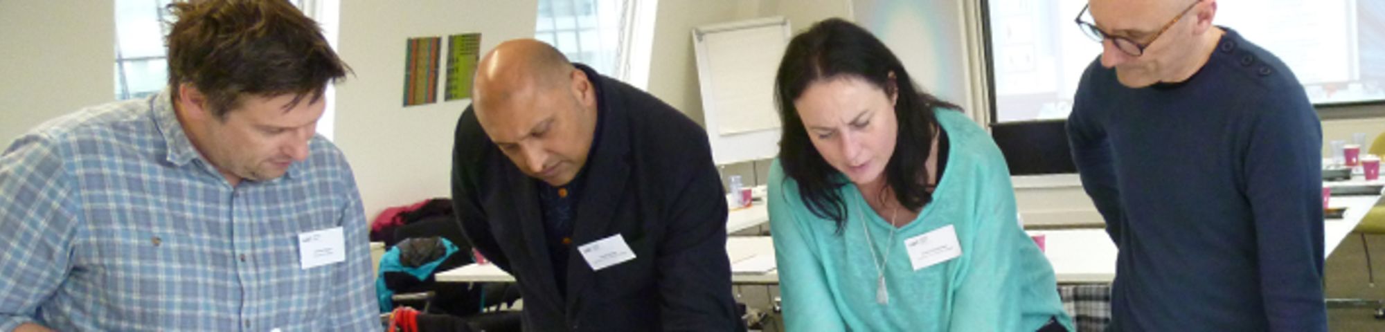 Teachers discussing final major projects