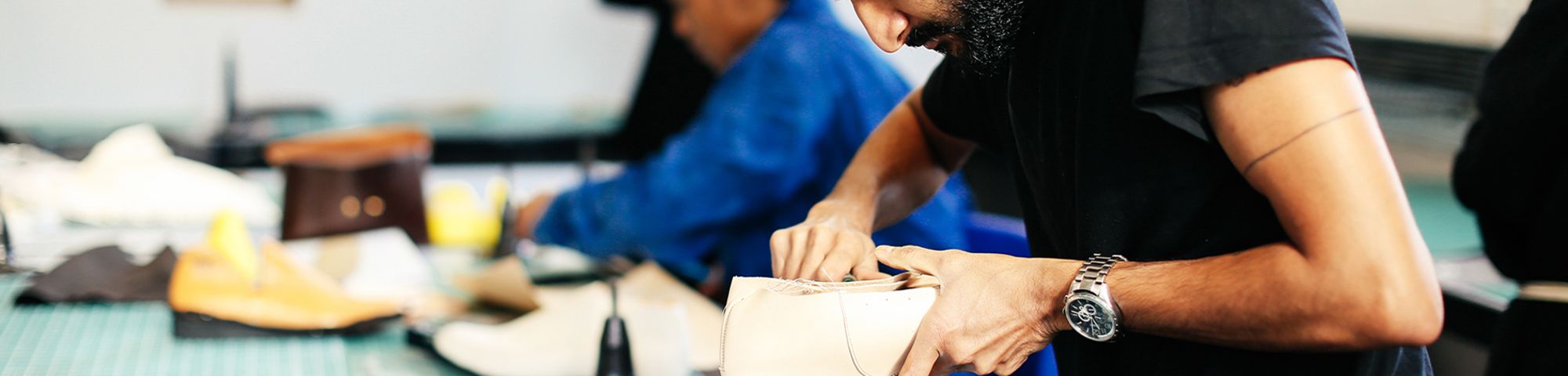 Photo of a man making shoes