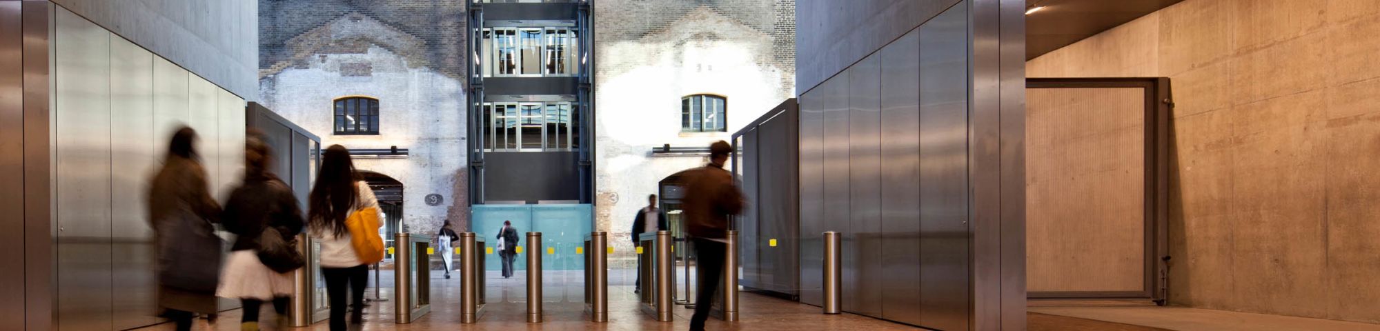Interior shot of Central Saint Martins. Students entering and exiting the building.