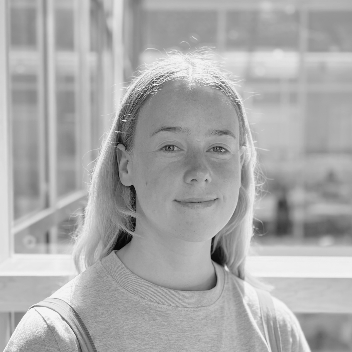 Liv Barnes, a white woman with blonde hair, smiling at the camera