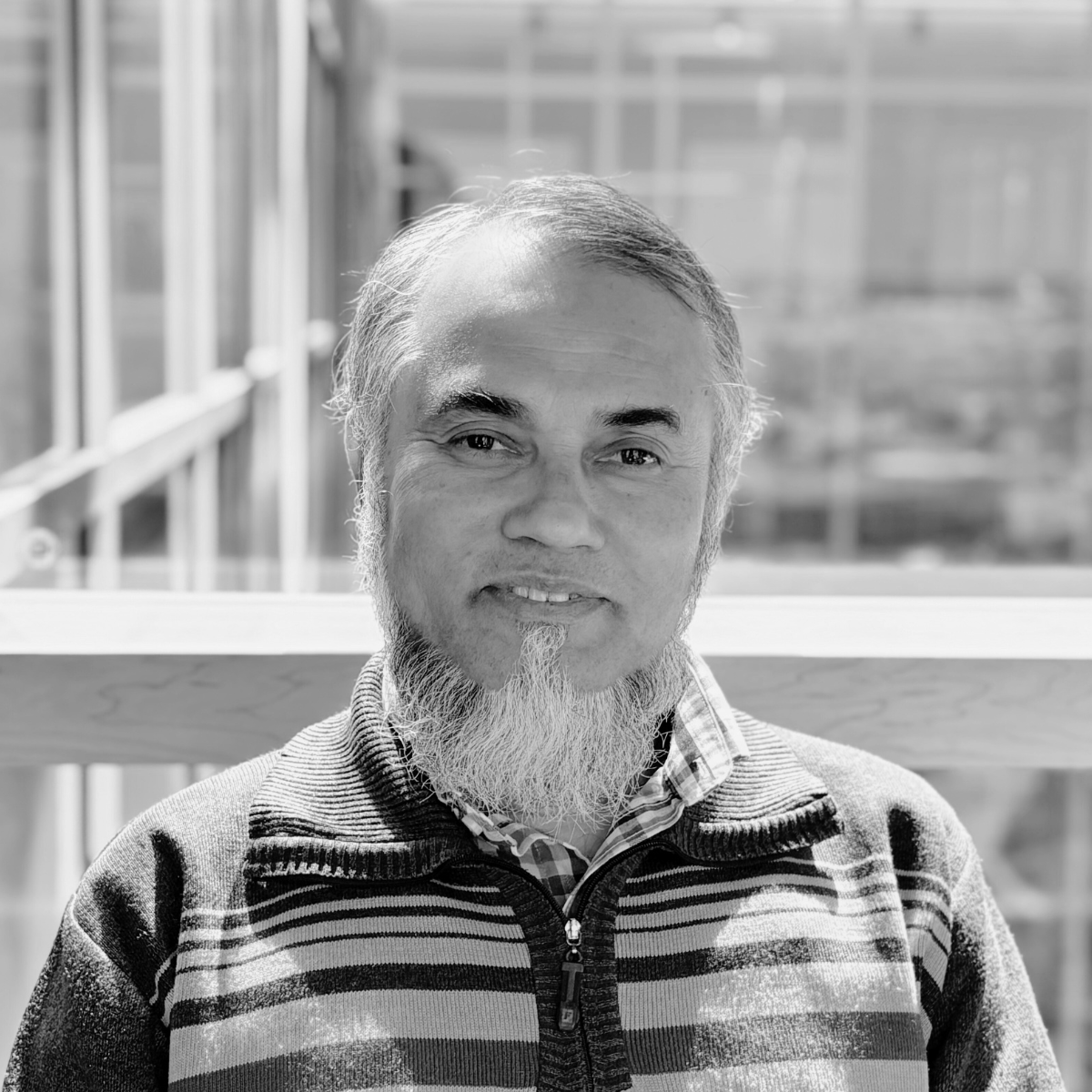 Professor Mohammad Mahbubul Hassan, a man with a beard, smiling at the camera