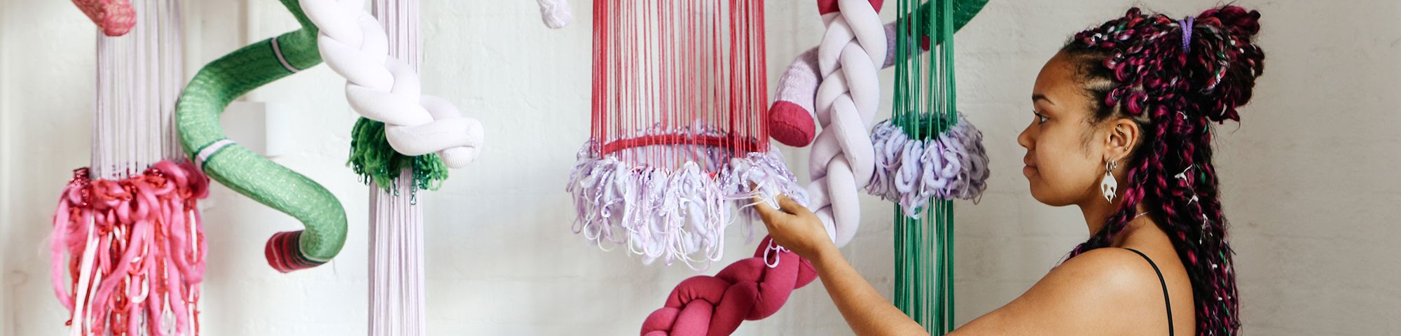 Textiles by Amelia Rodney hanging from ceiling