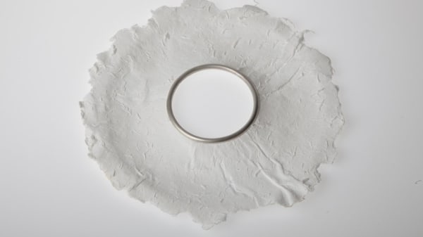 Object of the week: Rachel Galley's 'Paper Bangle' (2004). A large bangle made from paper with a silver insert. https://t.co/8F88gPDOax