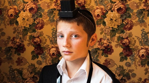 Jewish boy with wallpaper in background