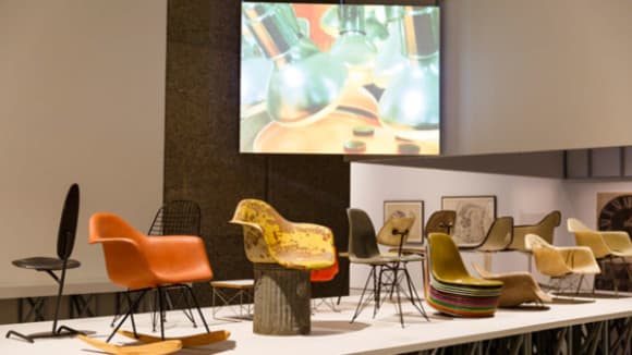 Chairs on a stage with a projector screen