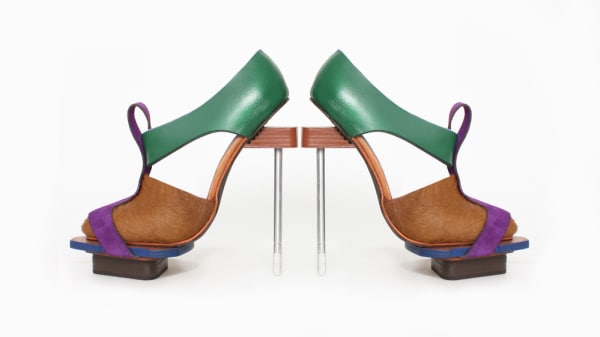 A pair of green, blue and brown shoes produced by a student at London College of Fashion