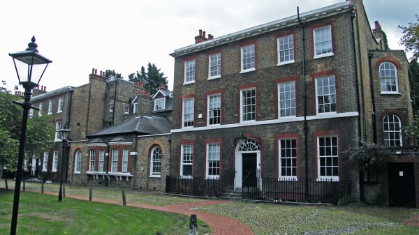 Photo of the exterior of Portland House and the lawn