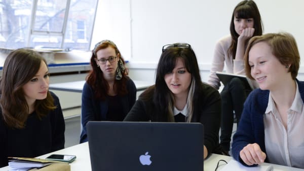 Students in front of laptop