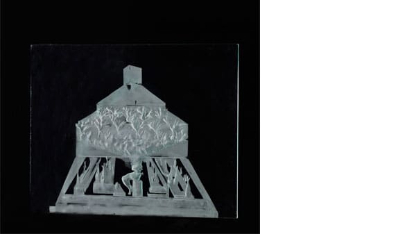 A sandblasted white image on a black background