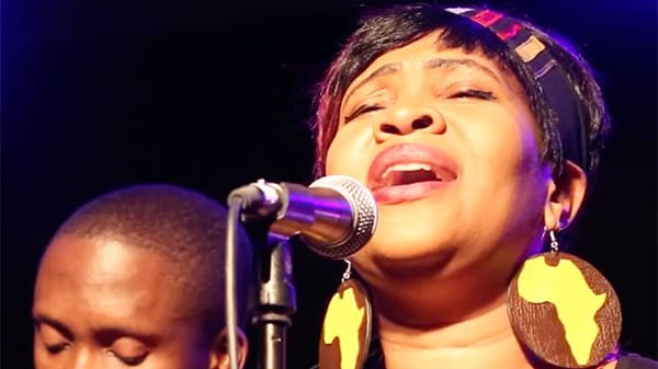 Film still showing two gospel singers.