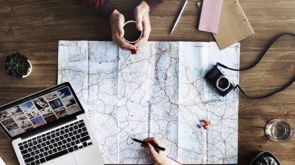Overview of someone making notes on on a map