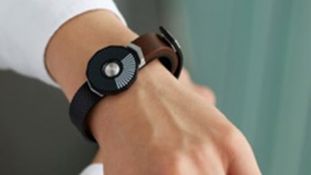 A modern watch strapped on a persons arm