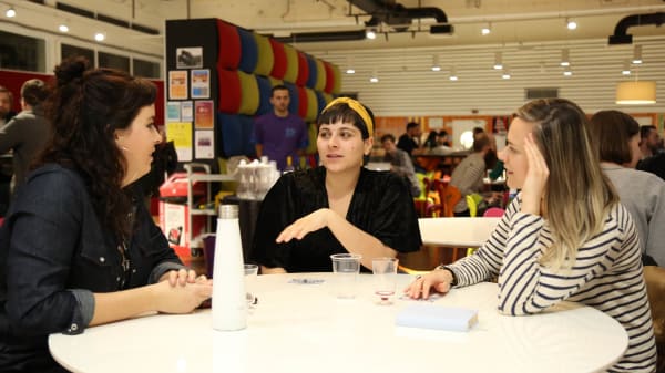 Mentor and mentees in conversation