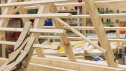 A large wooden construction on display in a workshop at Central Saint Martins