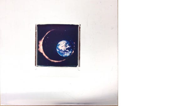 A small square image of an eclipse with a white border