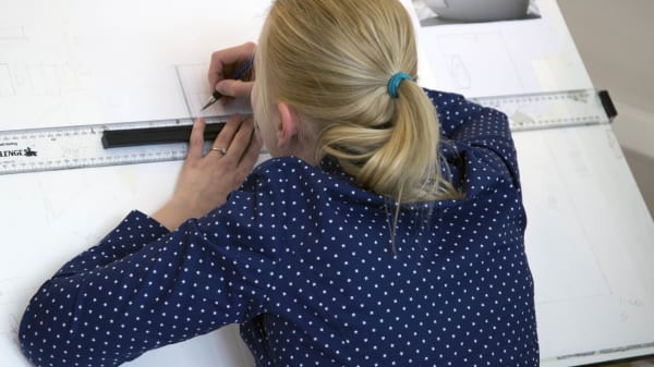 Student working on a technical drawing