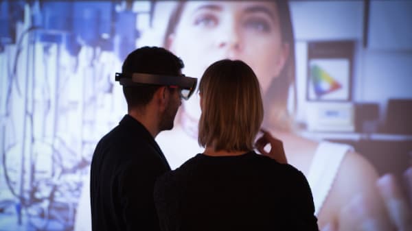 Two people in VR headsets.