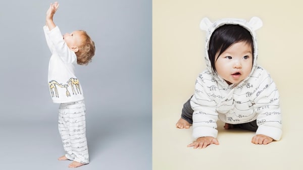 Two babies modelling designs created by Central Saint Martins students