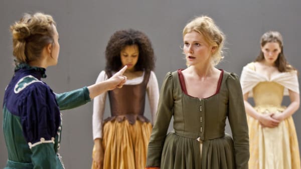 A group of actresses in period dress rehearsing a scene at Drama Centre London