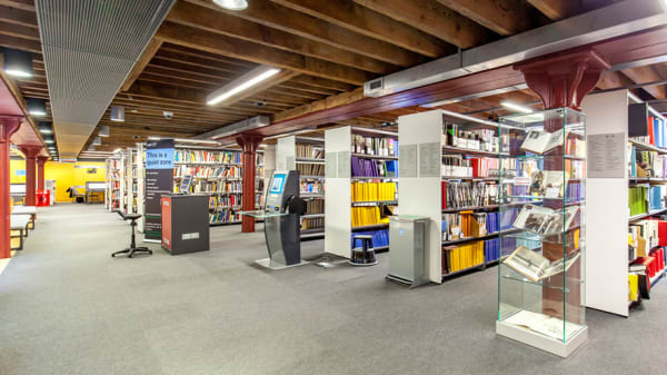 Rows of books and open area at CSM Library