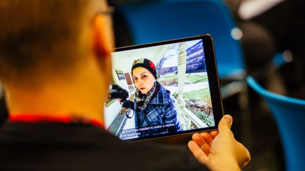 Woman holding videocamera