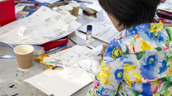 Student working on a book Illustration