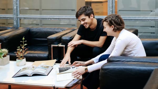 Two students in an office.