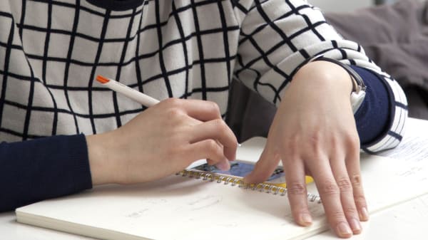 Student working in a sketchbook