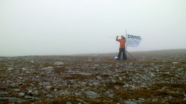 A person on top of a mountain