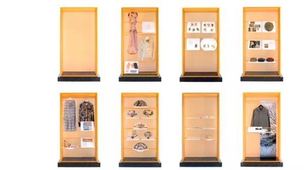 Two rows of yellow cabinets, four in each row, each displaying objects.