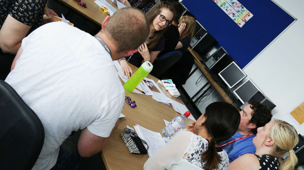 Students sitting round table
