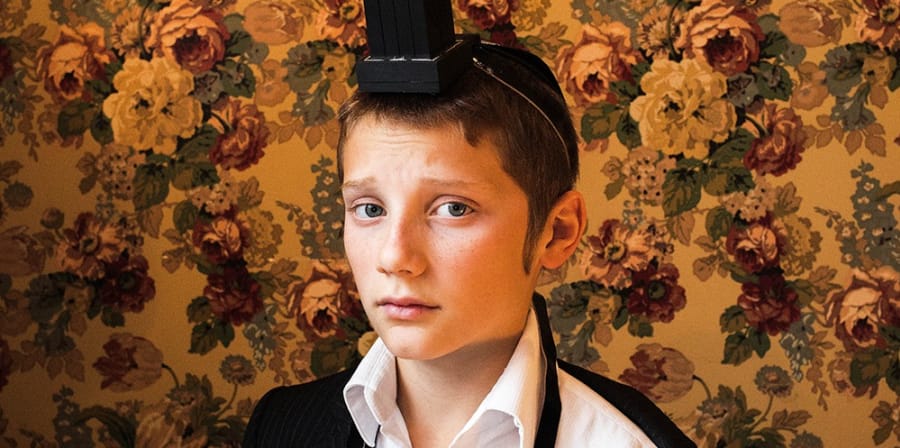 Jewish boy with wallpaper in background