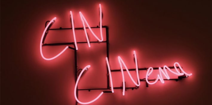 'Cin Cinema' written in pink neon