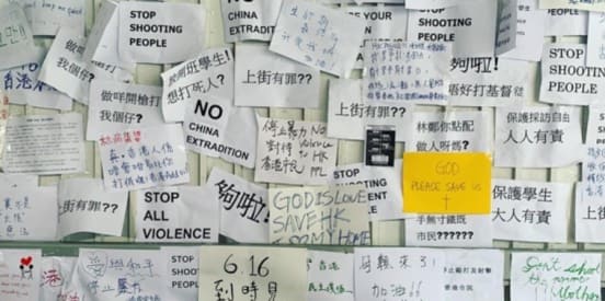 post its on a wall with chinese writing