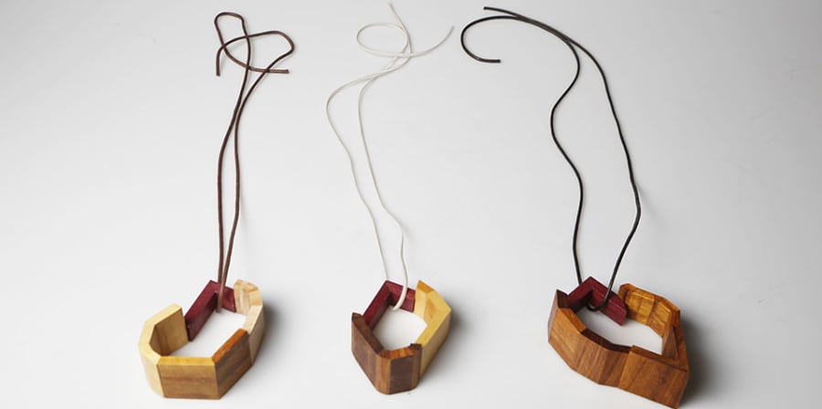 A collection of wooden jewellery pieces